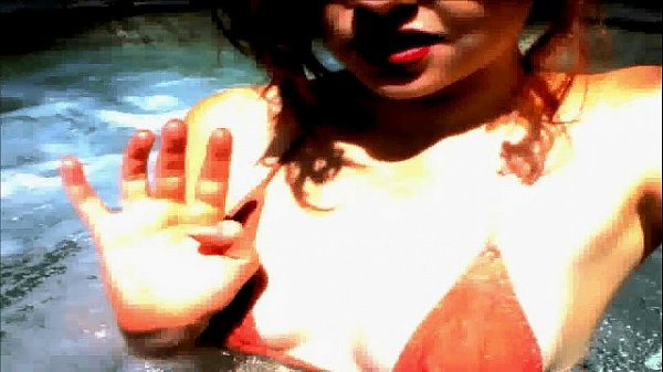 Brunette teen girl masturbates in pool on webcam