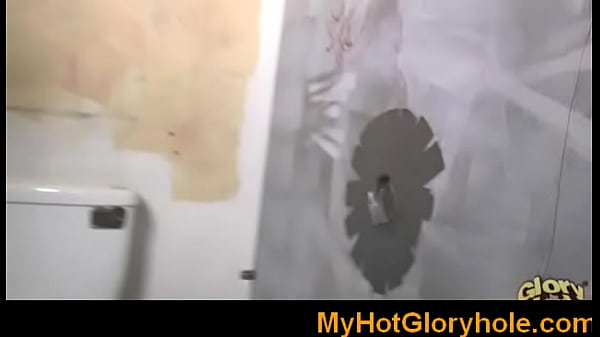 Woman sucking cock through a glory hole with another man watching
