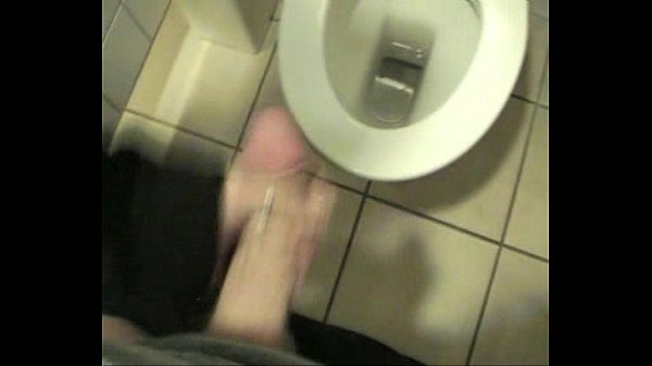 Teen brunette gives handjob in school bathroom
