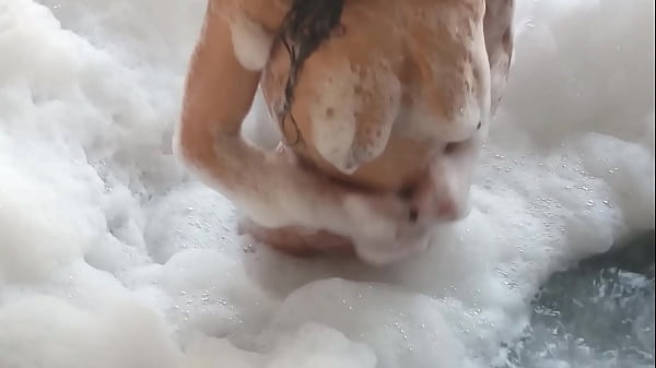Lolass36's busty Latina brunette gets caught by a guy in feminine clothing while bathing and has her pear-shaped ass fucked and anus buried.