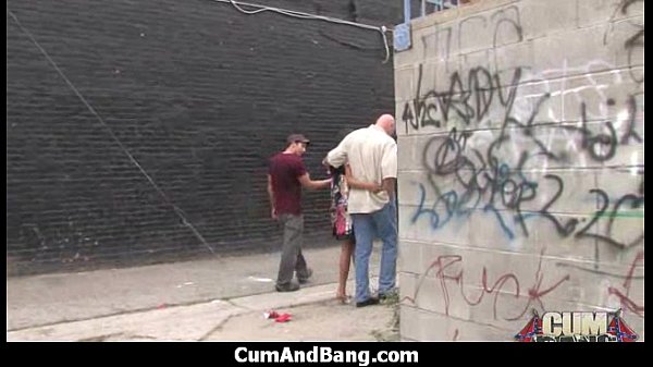 Ebony Slut from Ebony Slut Blows A Group Of Horny Dudes 15 gives deepthroat oral to multiple big cocks