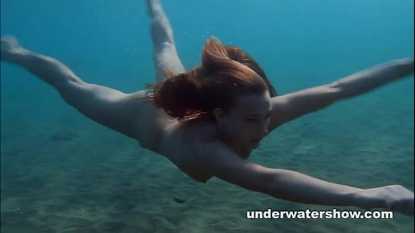 Nina Lee makes a splash at the beach with perfect tits