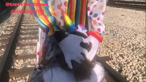 Clown gets blowjob while trying to beat train to the station