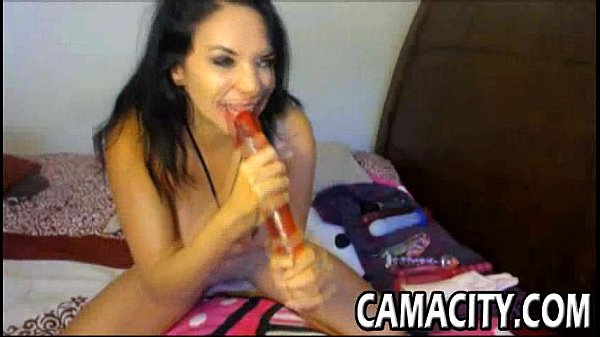 Curvy brunette rides dildo on cam